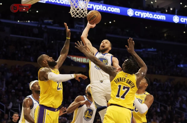 Golden State star Stephen Curry scores over Lakers star LeBron James, left, and forward Dorian Finney-Smith in the first half of the Warriors’ 123-116 win Thursday at Crypto.com Arena.