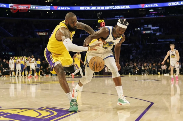 Lakers star LeBron James, left, steals the ball from Golden State Warriors forward Jimmy Butler in the closing seconds Thursday