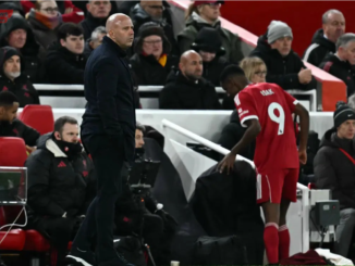 Liverpool’s Swedish striker Alexander Isak passes Liverpool’s Dutch manager Arne Slot as he leaves the pitch after being substituted off during the English Premier League football match between Liverpool and Sunderland at Anfield