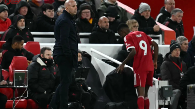 Liverpool’s Swedish striker Alexander Isak passes Liverpool’s Dutch manager Arne Slot as he leaves the pitch after being substituted off during the English Premier League football match between Liverpool and Sunderland at Anfield